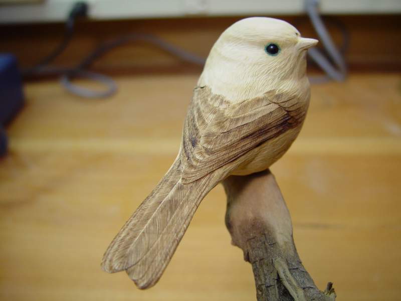 Carved chickadee before painting