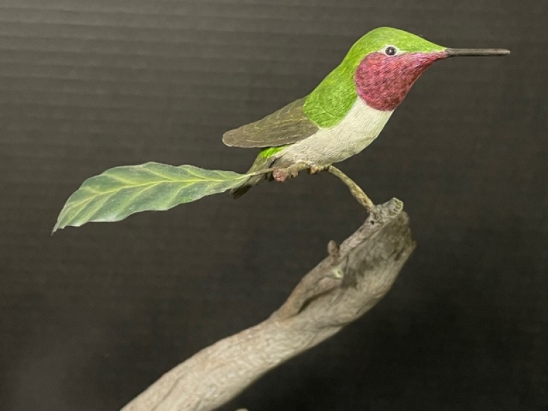 Carved songbird, side view